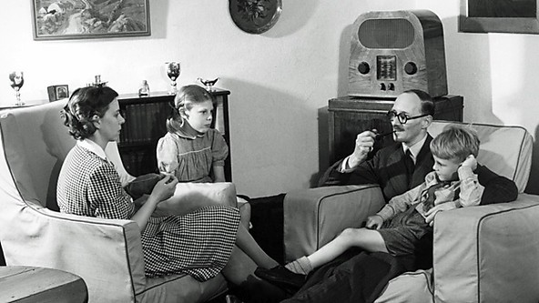 Family listening to radio.